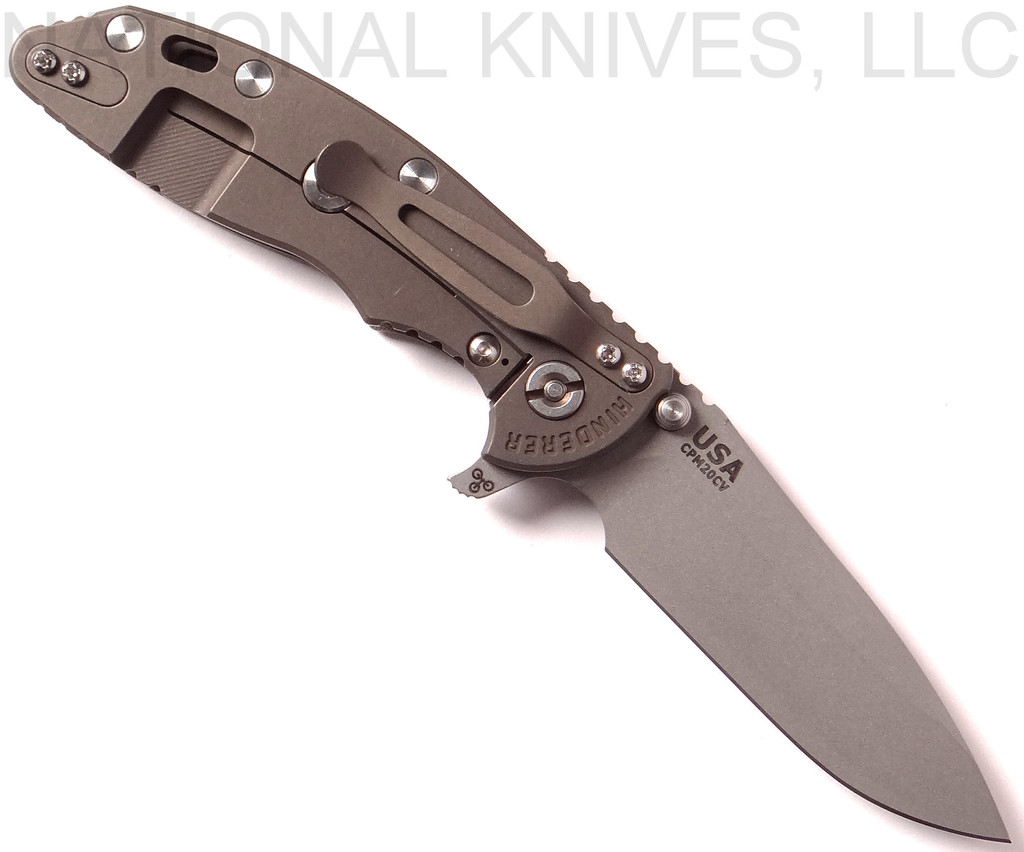 Rick Hinderer Knives XM-18 3.5" Spear Point folding knife with thumb stud and flipper tab - shown open lock side.  Working Finish 20CV stainless steel plain edge blade.  OD green G-10 handle with Battle Bronze lock side.  Model K2082SGW00.