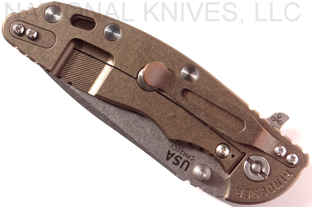 Rick Hinderer Knives XM-18 3.5" Spear Point folding knife with thumb stud and flipper tab - shown closed lock side.  Stonewash 20CV stainless steel plain edge blade.  FDE G-10 handle with stonewash bronze lock side.  Model K2082SGS00.
