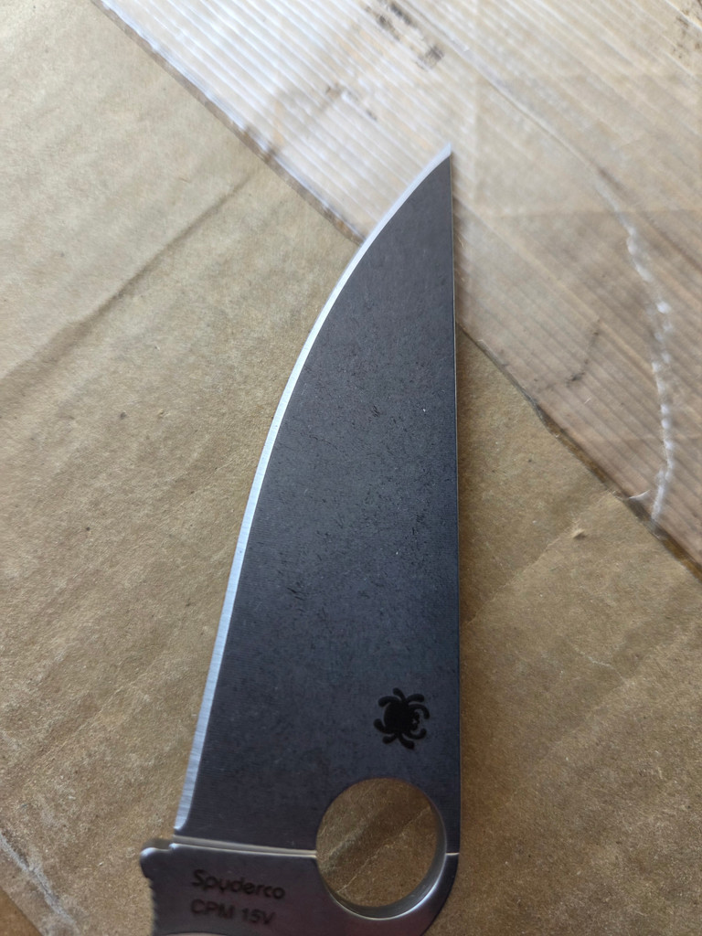 Used Spyderco Military 2 Sprint Run folding knife with thumb hole - close up of presentation side blade.  Stonewash 15V steel plain edge blade.  Brown G-10 handle.  Model C36GPBN15V2.