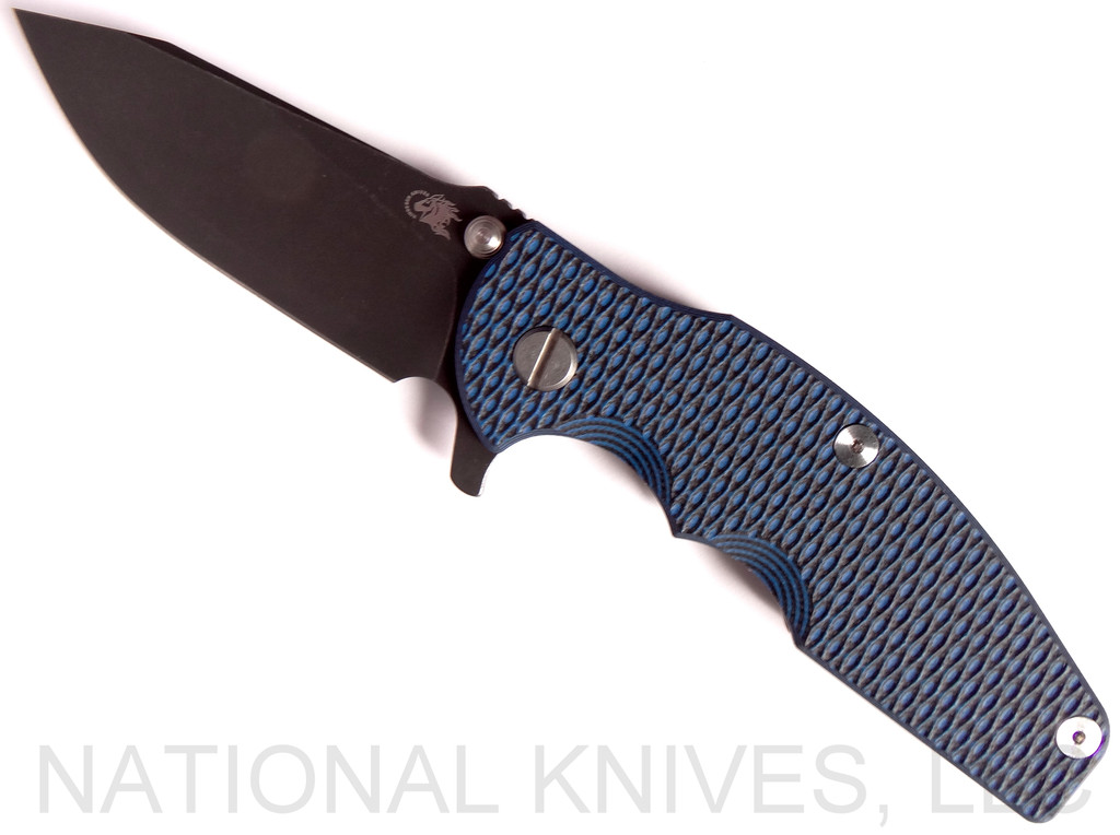 REFERENCE ONLY - Rick Hinderer Knives Jurassic Slicer Folding Knife, Battle Black 3.25" Plain Edge 20CV Blade. Battle Black Lock Side, Blue - Black G-10 Handle