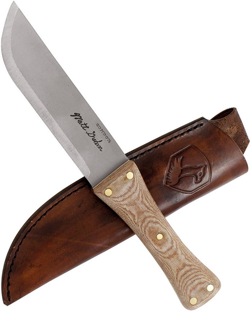 Condor Tool and Knife Primitive Camp fixed blade knife - shown out of sheath reverse with sheath in background.  1095 steel plain edge blade.  Micarta handle.  Model CTK3907-5.9.