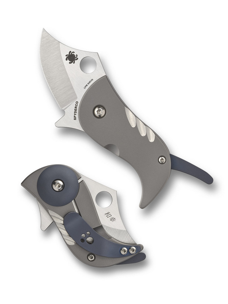 Spyderco Pochi folding knife with thumb hole - shown open presentation side and closed pocket clip side.  Satin S45VN stainless steel plain edge blade.  Titanium handle.  Model C256TIP.
For reference only.
