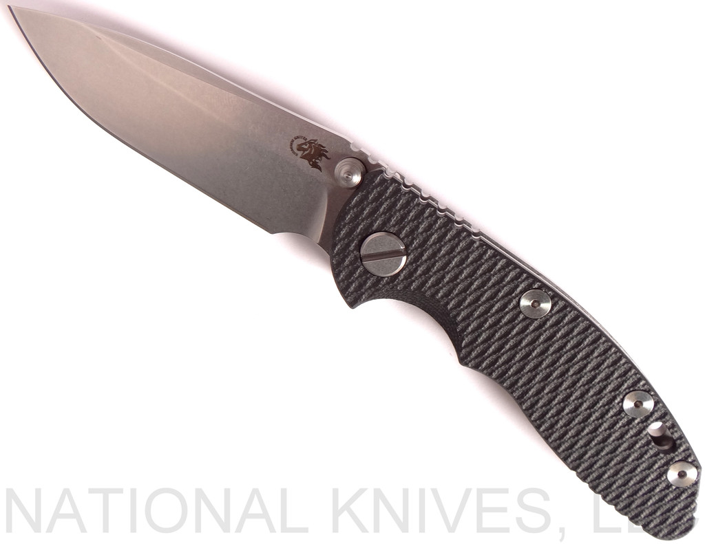 Rick Hinderer Knives XM-18 3.0" Spear Point Non Flipper folding knife with thumb studs - shown open presentation side.  Stonewash 20CV stainless steel plain edge blade.  Black G-10 handle with stonewash lock side.  Model K10813SGS00.