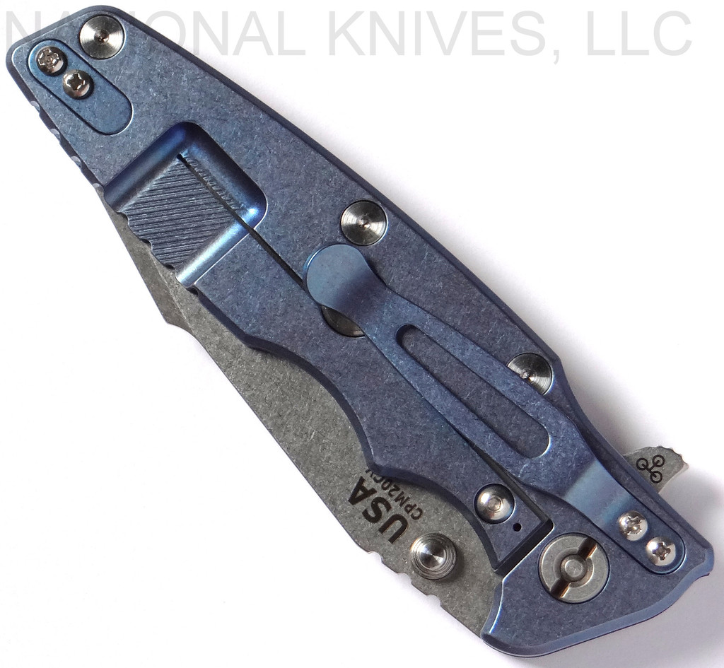 Rick Hinderer Knives Eklipse Harpoon Tanto folding knife with thumb stud and flipper tab - shown closed lock side.  Stonewash 20CV stainless steel plain edge blade.  Black G-10 handle with stonewash blue lock side.  Model K4054SGS00.