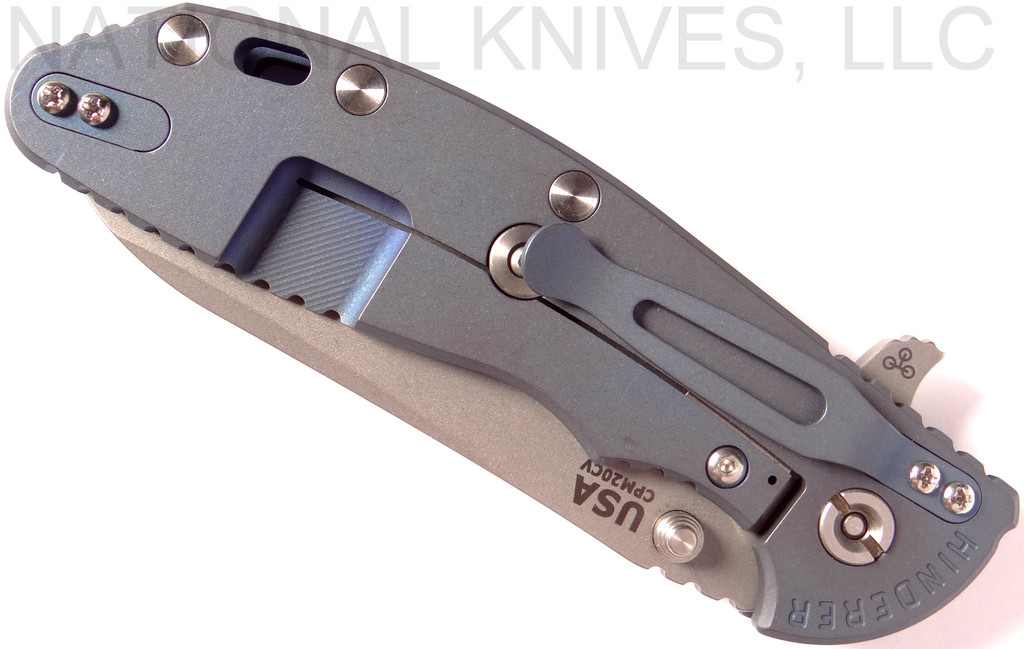 Rick Hinderer Knives XM-24 Sheepsfoot folding knife with thumb stud and flipper tab - shown closed lock side.  Working Finish 20CV stainless steel plain edge blade.  Blue - black G-10 handle with Battle Blue lock side.  Model K3073SGW00.
