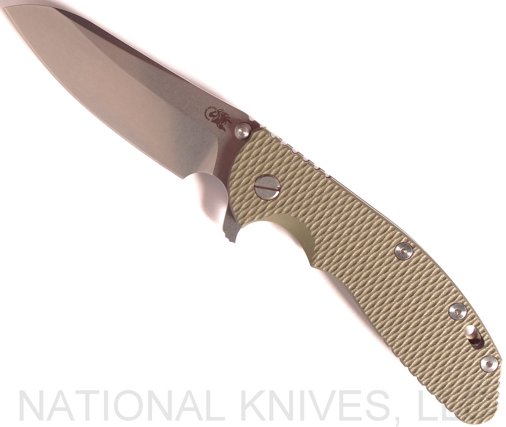 Rick Hinderer Knives XM-24 Sheepsfoot folding knife with thumb stud and flipper tab - shown open presentation side.  Stonewash 20CV stainless steel plain edge blade.  OD green G-10 handle with stonewash bronze lock side.  Model K3073SGS00.

