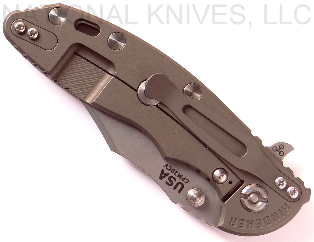 Rick Hinderer Knives XM-18 3.5" Bowie folding knife with thumb stud and flipper tab - shown closed lock side.  Working Finish 20CV stainless steel plain edge blade.  Coyote G-10 handle with Battle Bronze titanium lock side.  Model K2032SGW00.