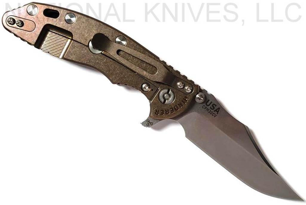 Rick Hinderer Knives XM-18 3.5" Bowie folding knife with thumb stud and flipper tab - shown open lock side.  Stonewash 20CV stainless steel plain edge blade.  OD green - black G-10 handle with stonewash bronze titanium lock side.  Model K2032SGS00.
