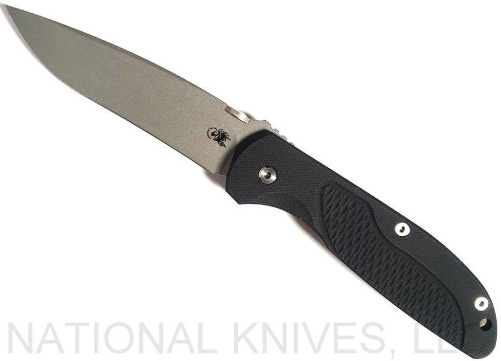 Rick Hinderer Knives Firetac Recurve folding knife with thumb disk - shown open presentation side.  Working Finish 20CV stainless steel plain edge blade.  Black G-10 handle with Battle Bronze lock side.  Model K205FSGW00.