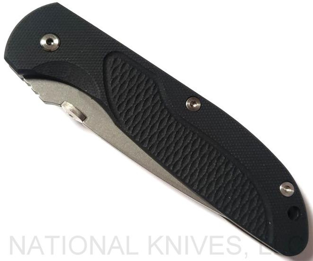 Rick Hinderer Knives Firetac Recurve folding knife with thumb disk - shown closed presentation side.  Working Finish 20CV stainless steel plain edge blade.  Black G-10 handle with Battle Bronze lock side.  Model K205FSGW00.