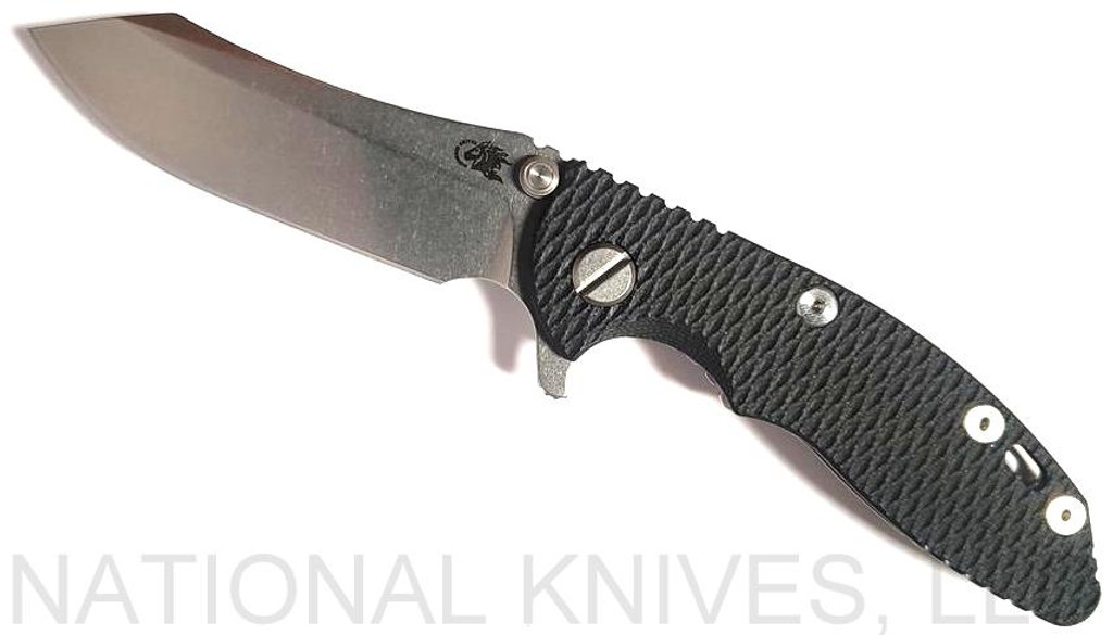 Rick Hinderer Knives XM-18 3.0" Skinner folding knife with thumb studs and flipper tab - shown open presentation side.  Stonewashed 20CV stainless steel plain edge blade.  Black G-10 handle with stonewashed lock side.  Model K1041SGS00.