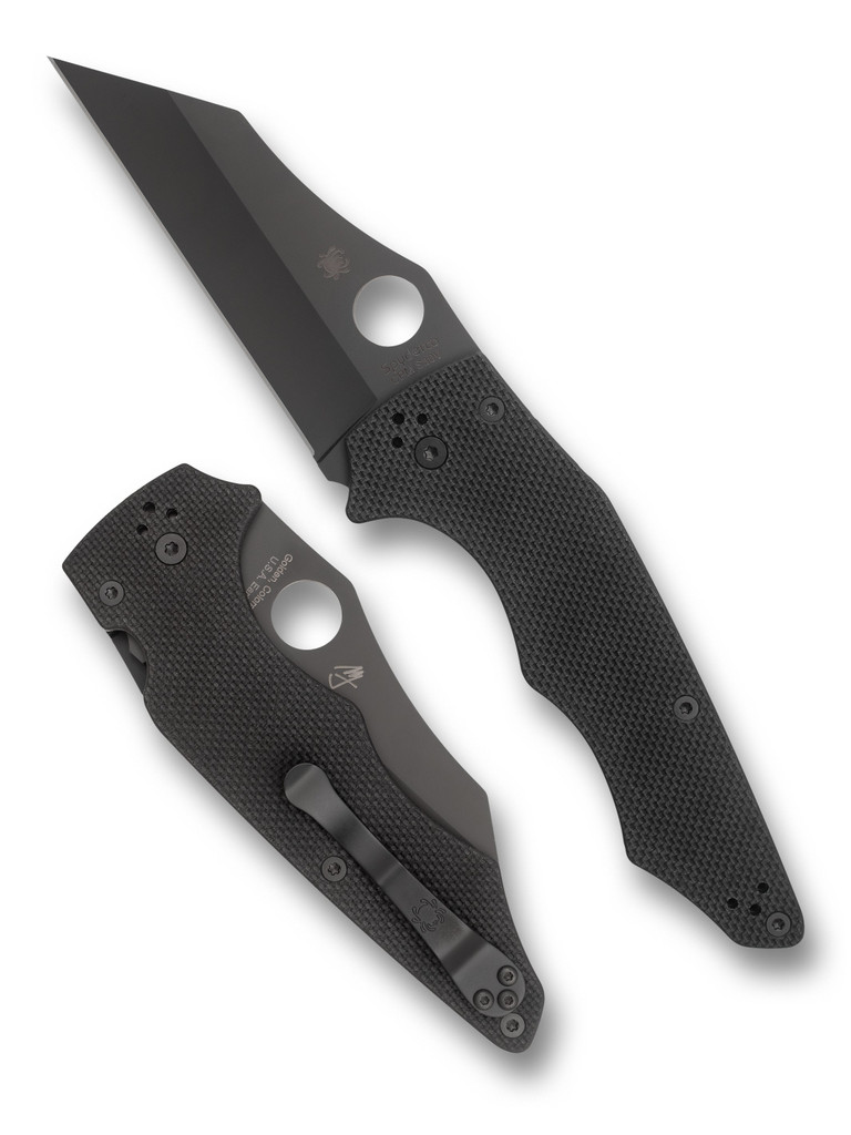 Spyderco Yojumbo folding knife with thumb hole - shown open presentation side and closed pocket clip side.  Black S30V stainless steel plain edge blade.  Black G-10 handle.  Model C253GPBBK.