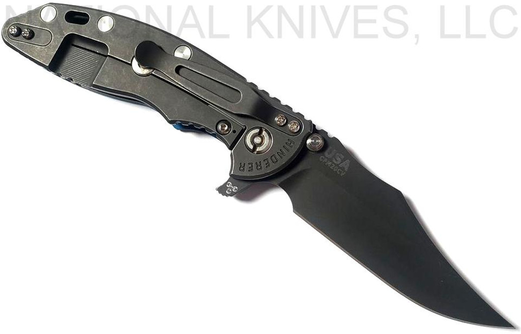Rick Hinderer Knives XM-18 3.5" Bowie folding knife with thumb stud and flipper tab - shown open lock side.  Battle Black 20CV stainless steel plain edge blade.  Blue - black G-10 handle with Battle Black titanium lock side.  Model K20320SNNC.