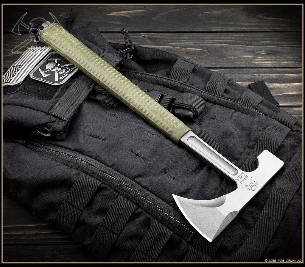 RMJ Tactical L13 Loggerhead tomahawk - shown out of sheath reverse.  Tungsten Cerakote 80CRV2 steel plain edge head.  Green handle.