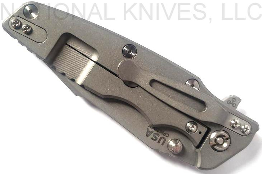 Rick Hinderer Knives Eklipse Harpoon Spanto folding knife with thumb stud and flipper tab - shown closed lock side.  Working Finish 20CV stainless steel plain edge blade.  Blue - black G-10 handle with Working Finish lock side.  Model K40442SGW00.