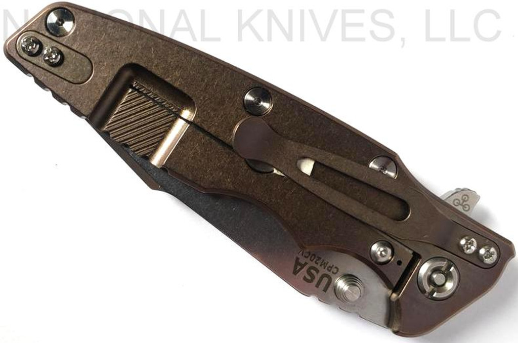 Rick Hinderer Knives Eklipse Harpoon Spanto folding knife with thumb stud and flipper tab - shown closed lock side.  Stonewash 20CV stainless steel plain edge blade.  Black G-10 handle with stonewash bronze lock side.  Model K40442SGS00.