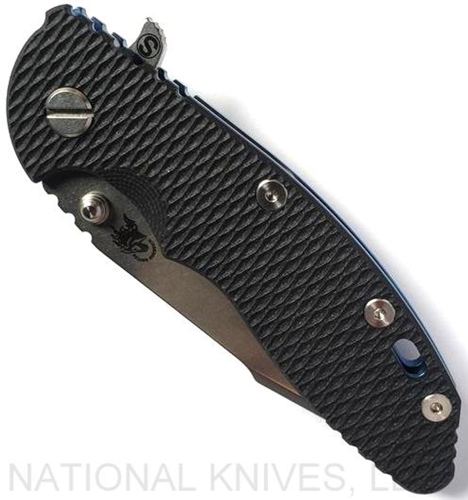 Rick Hinderer Knives Skinny XM-18 3.5" Harpoon Spanto folding knife with thumb stud and flipper tab - shown closed presentation side.  Stonewash 20CV stainless steel plain edge blade.  Black G-10 handle with stonewash blue lock side.  Model K2555SGS00.