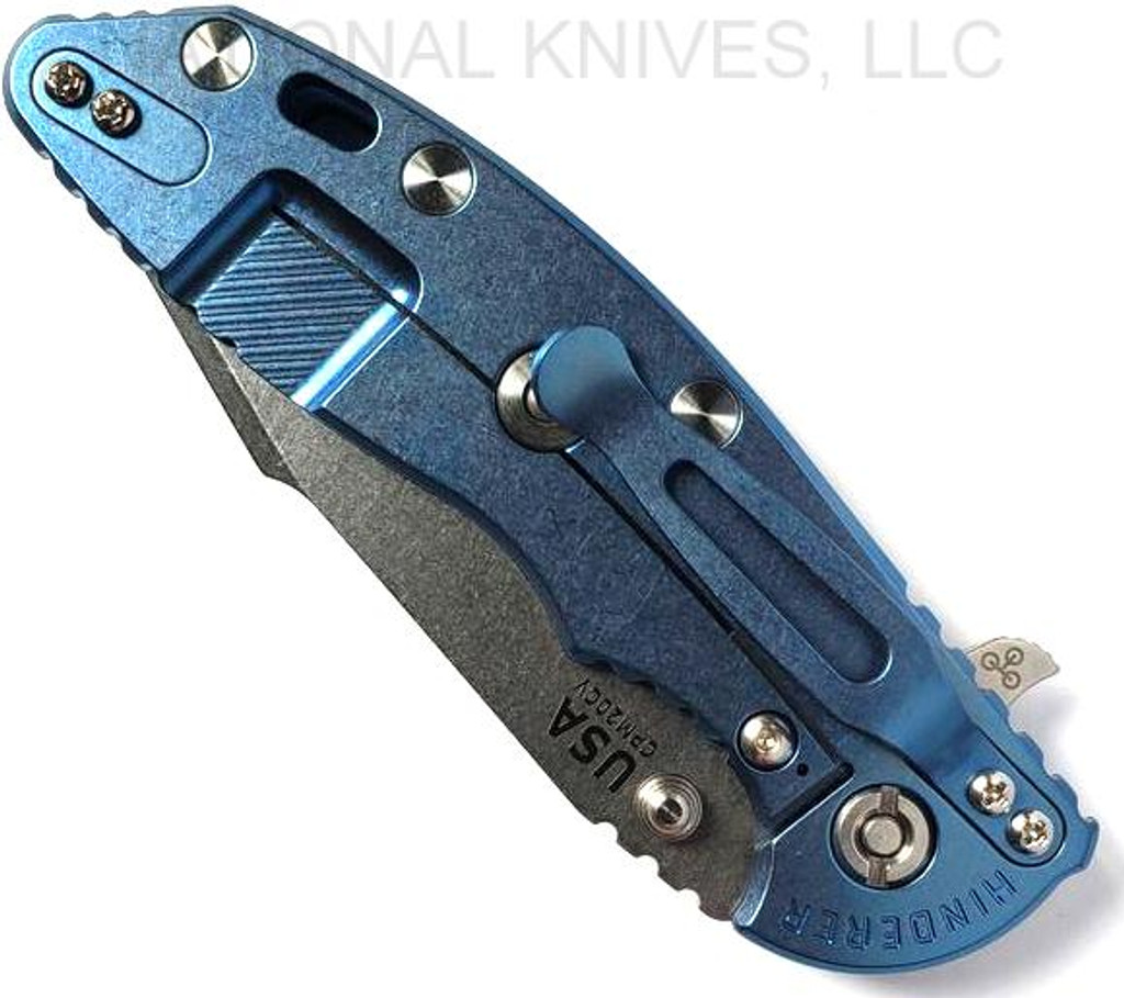 Rick Hinderer Knives Skinny XM-18 3.5" Harpoon Spanto folding knife with thumb stud and flipper tab - shown closed lock side.  Stonewash 20CV stainless steel plain edge blade.  Black G-10 handle with stonewash blue lock side.  Model K2555SGS00.