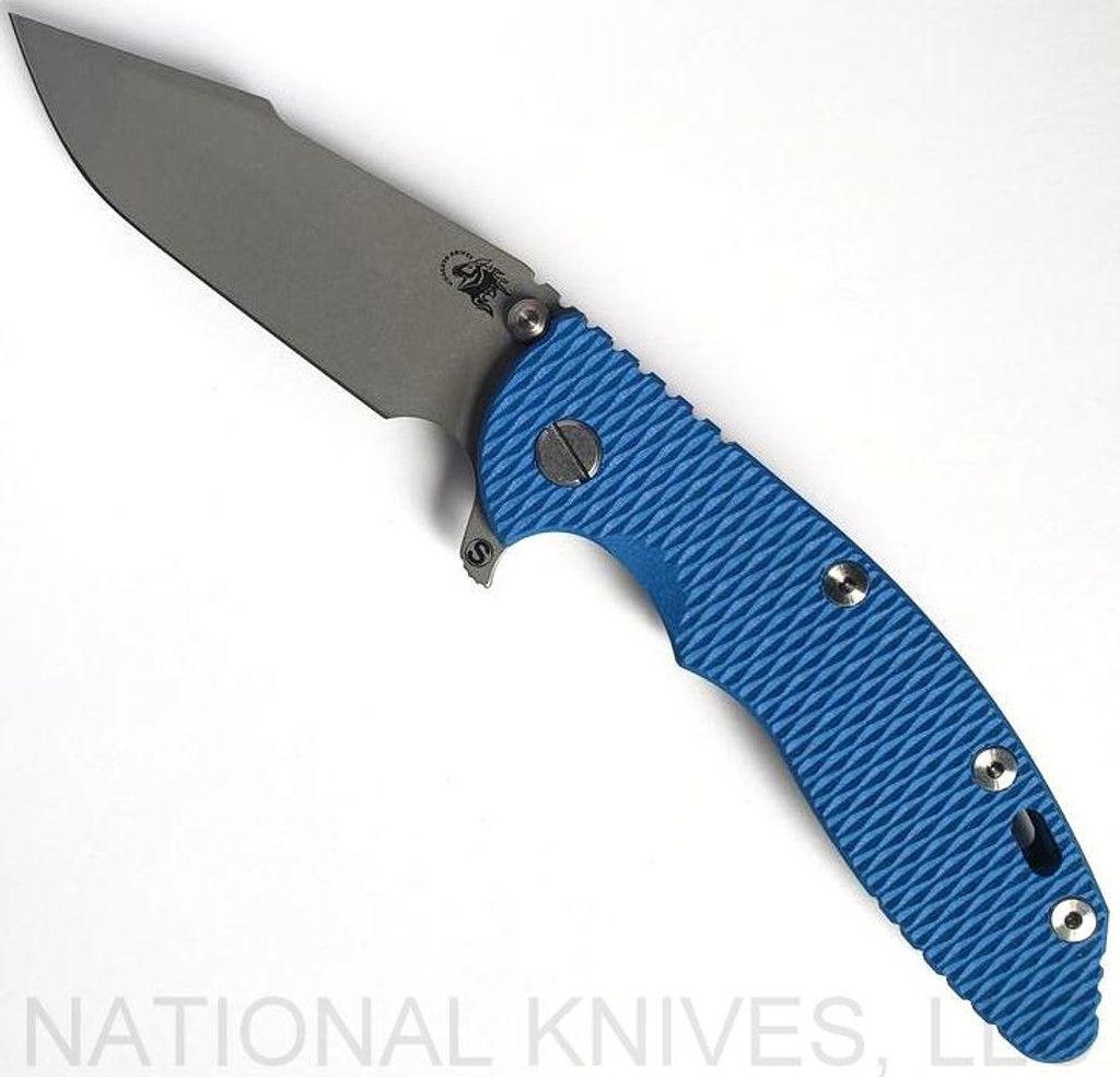 Rick Hinderer Knives Skinny XM-18 3.5" Harpoon Spanto folding knife with thumb stud and flipper tab - shown open presentation side.  Working Finish 20CV stainless steel plain edge blade.  Blue G-10 handle with Battle Blue lock side.  Model K2555SGW00.
