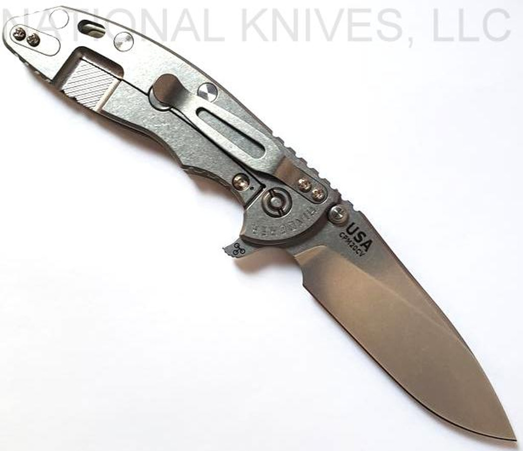 Rick Hinderer Knives XM-18 3.5" Slicer folding knife with thumb stud and flipper tab - shown open lock side.  Stonewash 20CV stainless steel plain edge blade.  Translucent Green G-10 handle with stonewash lock side.  Model K310102S000.
