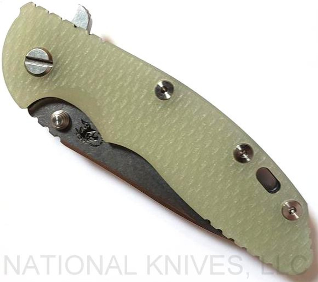 Rick Hinderer Knives XM-18 3.5" Slicer folding knife with thumb stud and flipper tab - shown closed presentation side.  Stonewash 20CV stainless steel plain edge blade.  Translucent Green G-10 handle with stonewash lock side.  Model K310102S000.
