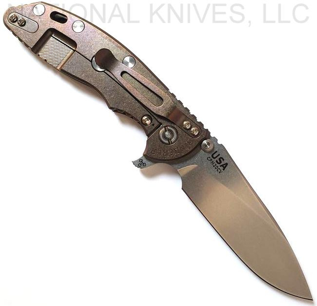 Rick Hinderer Knives XM-18 3.5" Slicer folding knife with thumb stud and flipper tab - shown open lock side.  Stonewash 20CV stainless steel plain edge blade.  OD green G-10 handle with stonewash bronze lock side.  Model K310102S000.