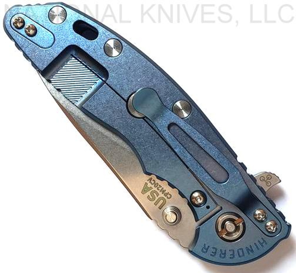 Rick Hinderer Knives XM-18 3.5" Slicer folding knife with thumb stud and flipper tab - shown closed lock side.  Stonewash 20CV stainless steel plain edge blade.  Blue - black G-10 handle with stonewash blue lock side.  Model K310102S000.