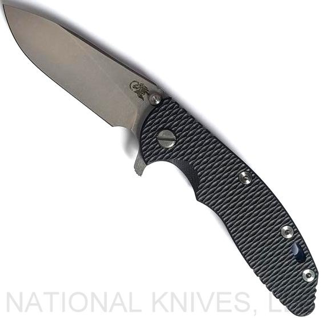 Rick Hinderer Knives XM-18 3.5" Slicer folding knife with thumb stud and flipper tab - shown open presentation side.  Stonewash 20CV stainless steel plain edge blade.  Black G-10 handle with stonewash blue titanium lock side.  Model K2012SGS00.