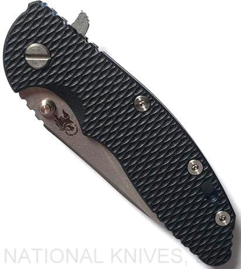 Rick Hinderer Knives XM-18 3.5" Slicer folding knife with thumb stud and flipper tab - shown closed presentation side.  Stonewash 20CV stainless steel plain edge blade.  Black G-10 handle with stonewash blue titanium lock side.  Model K2012SGS00.