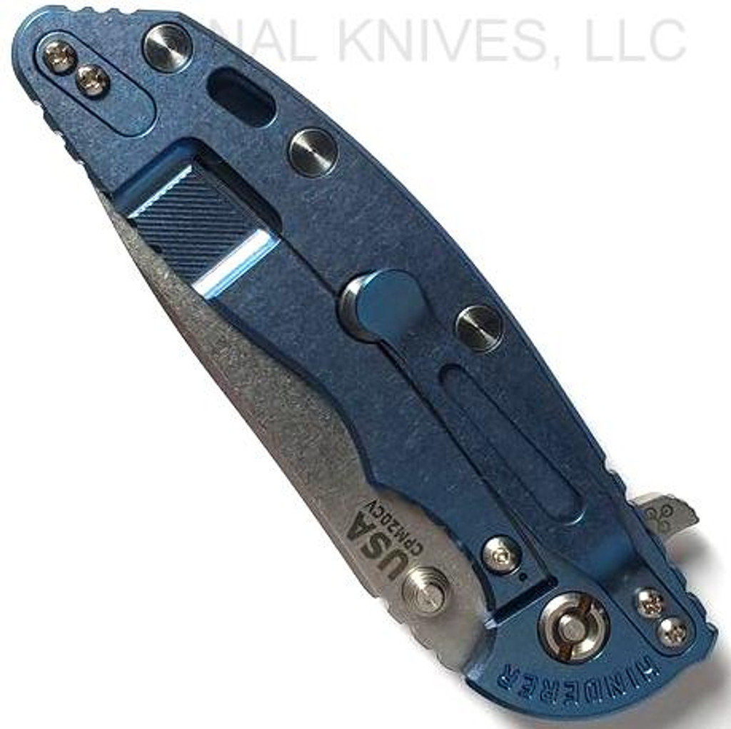 Rick Hinderer Knives XM-18 3.5" Slicer folding knife with thumb stud and flipper tab - shown closed lock side.  Stonewash 20CV stainless steel plain edge blade.  Black G-10 handle with stonewash blue titanium lock side.  Model K2012SGS00.