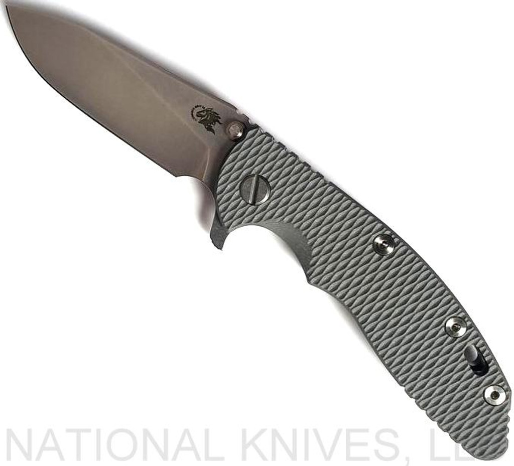 Rick Hinderer Knives XM-18 3.5" Slicer folding knife with thumb stud and flipper tab - shown open presentation side.  Stonewash 20CV stainless steel plain edge blade.  Grey G-10 handle with stonewash titanium lock side.  Model K2012SGS00.