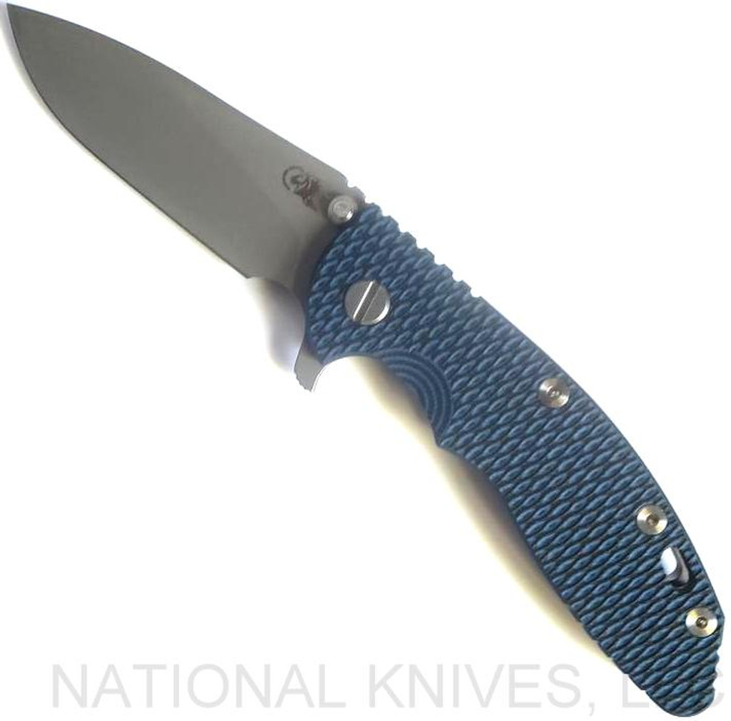 Rick Hinderer Knives XM-18 3.5" Slicer folding knife with thumb stud and flipper tab - shown open presentation side.  Working Finish 20CV stainless steel plain edge blade.  Blue - black G-10 handle with Working Finish lock side.  Model K310102001.