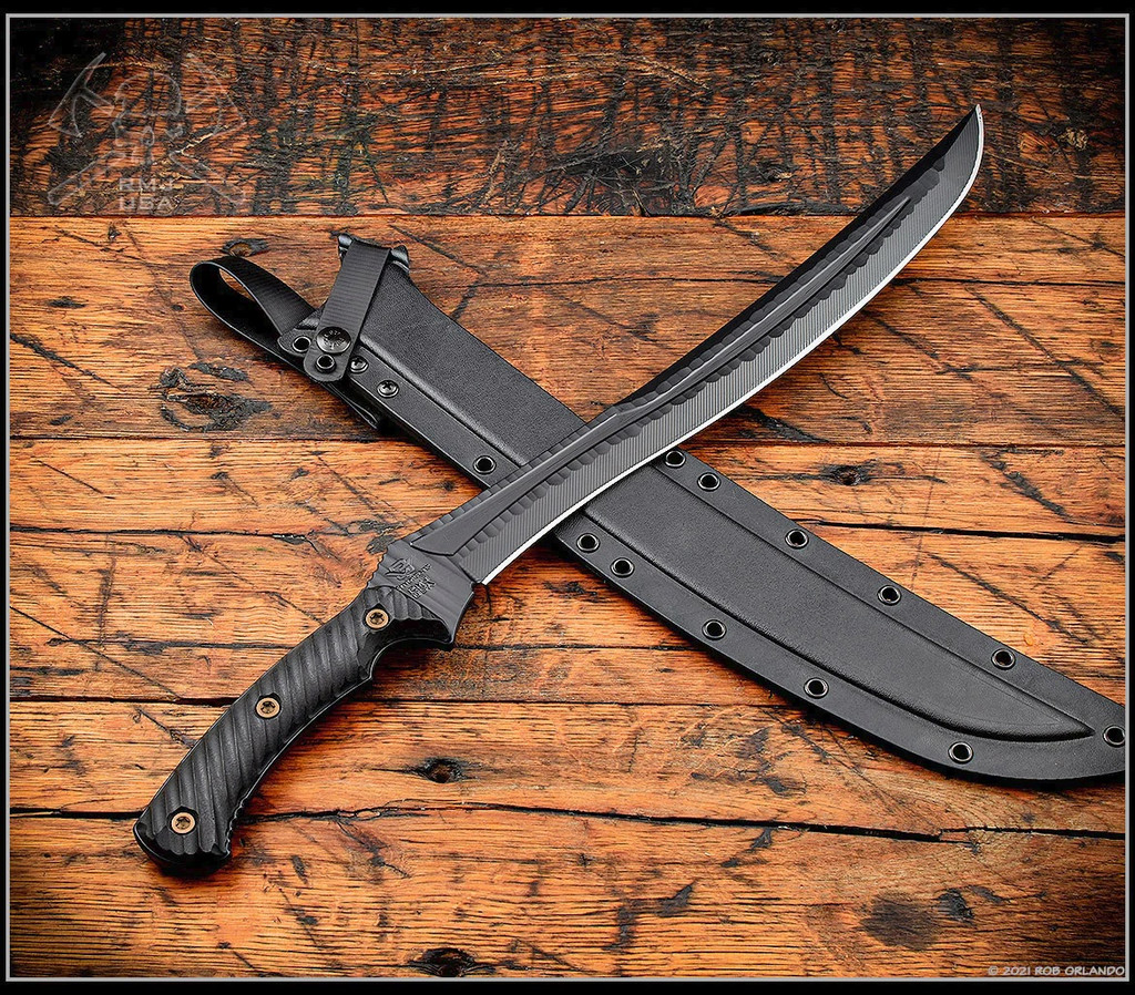 RMJ Tactical Wyvern short sword - shown atop sheath tip pointed upper right.  Textured black 3V steel plain edge blade.  Black G-10 handle scales.  Model 3V-WY-BT-BK.