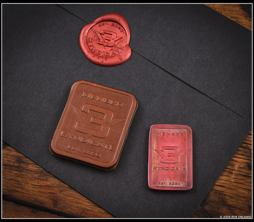 RMJ Tactical Wyvern short sword - 3V Syndicate leather patch and copper coin.  Textured black 3V steel plain edge blade.  Black G-10 handle scales.  Model 3V-WY-BT-BK.