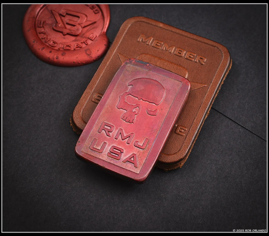 RMJ Tactical Wyvern short sword - 3V Syndicate leather patch and copper coin.  Textured black 3V steel plain edge blade.  Black G-10 handle scales.  Model 3V-WY-BT-BK.