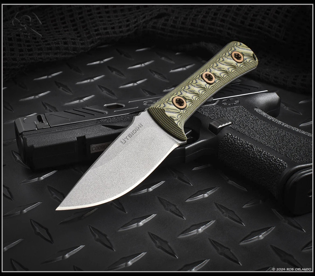 RMJ Tactical Utsidihi fixed blade knife - shown out of sheath reverse.  Tungsten Cerakote Nitro-V stainless steel plain edge blade.  Dirty Olive G-10 handle.  Model K-UT2-TU-DO.