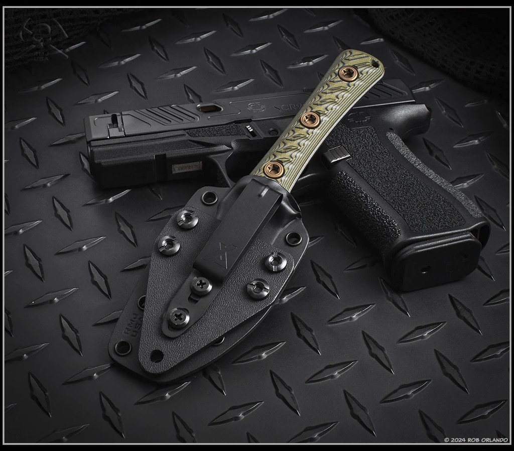 RMJ Tactical Utsidihi fixed blade knife - shown in sheath reverse.  Tungsten Cerakote Nitro-V stainless steel plain edge blade.  Dirty Olive G-10 handle.  Model K-UT2-TU-DO.