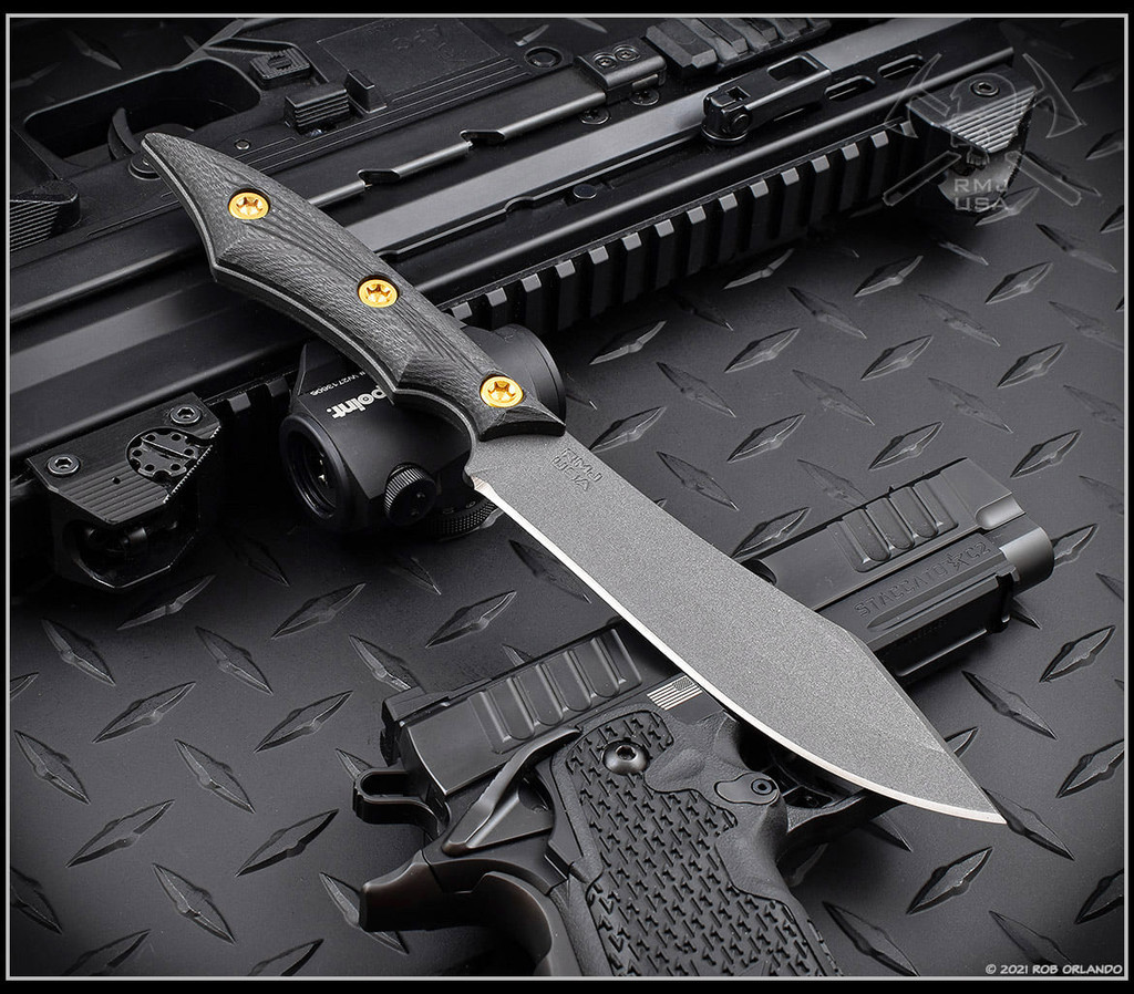 RMJ Tactical Ratatosk fixed blade knife - shown out of sheath obverse.  Cobalt Cerakote Nitro-V stainless steel plain edge blade.  Black carbon fiber handle.