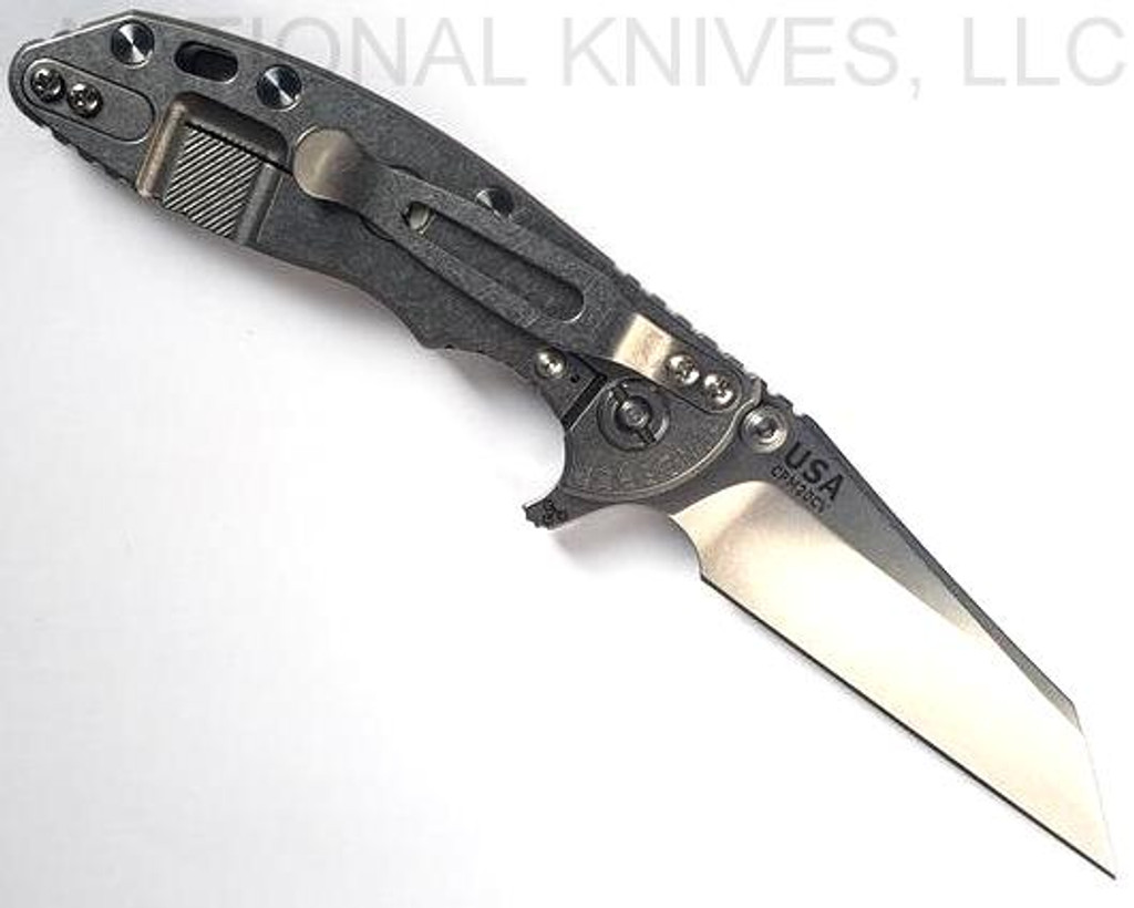 Rick Hinderer Knives XM-18 3.0" Wharncliffe folding knife with thumb stud and flipper tab - shown open lock side.  Stonewash 20CV stainless steel plain edge blade.  OD green G-10 handle with stonewash lock side.  Model KXM3000WC.