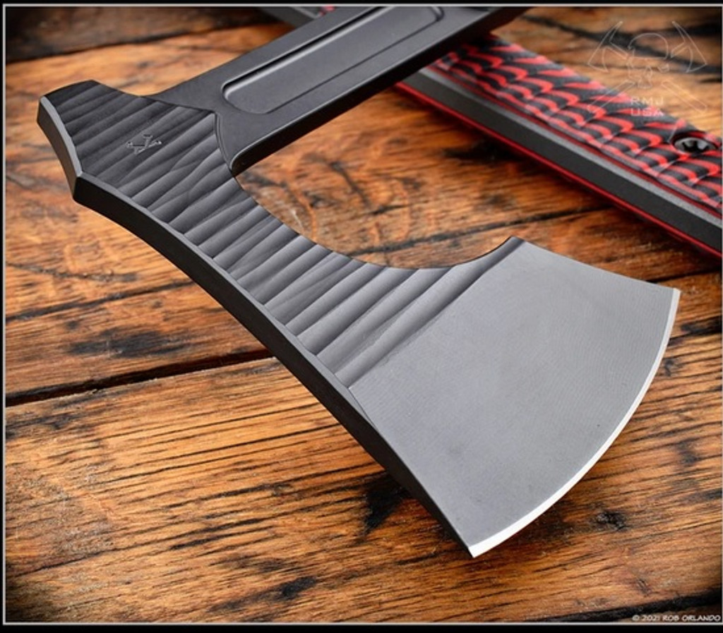 RMJ Tactical 3V Syndicate Raven tomahawk - shown close up of head out of sheath reverse.  Textured black Cerakote CPM-3V steel plain edge head.  Black Widow G-10 handle.
For reference only.