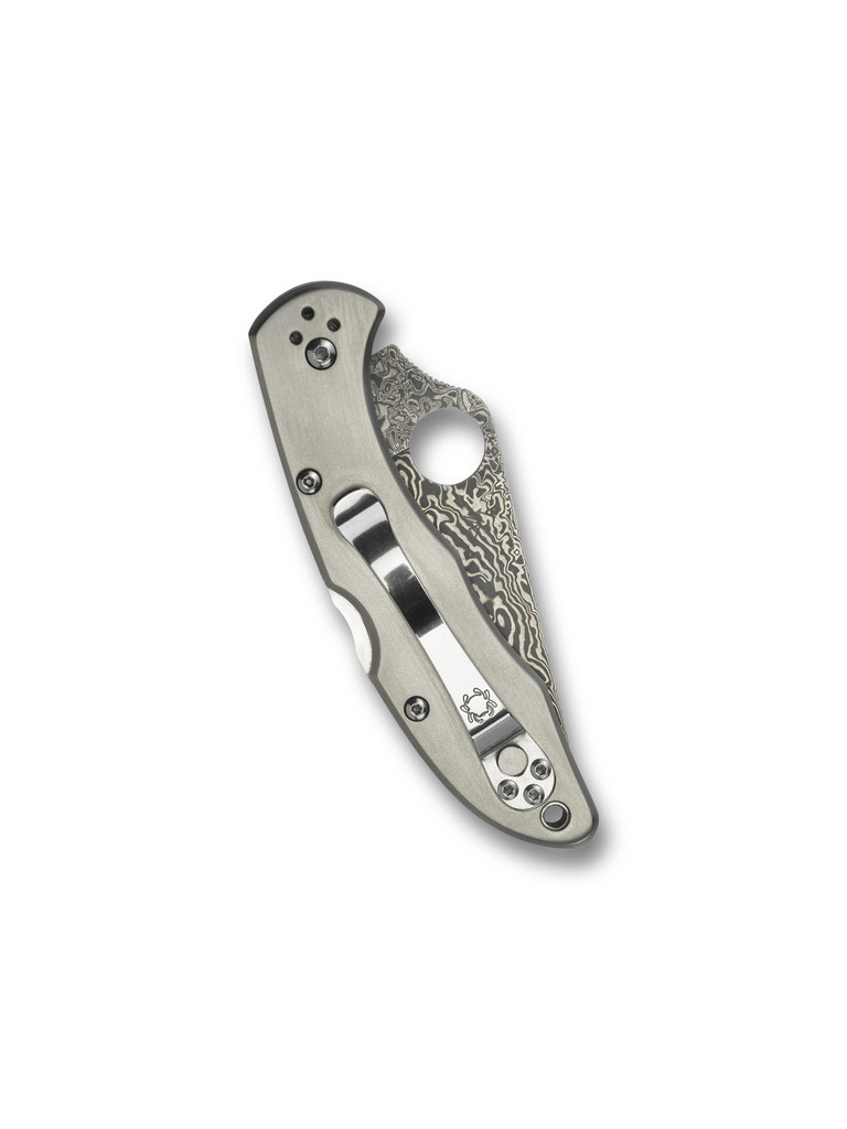 Spyderco Delica 4 folding knife with thumb hole - shown closed pocket clip side.  VG-10 Damascus steel plain edge blade.  Titanium handle.  Model C11TIPD.