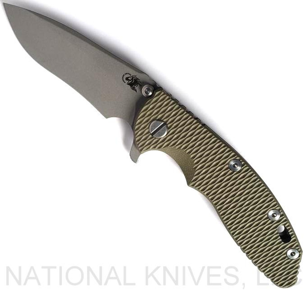 Rick Hinderer Knives XM-18 3.5" Recurve folding knife with thumb stud and flipper tab - shown open presentation side.  Working Finish 20CV stainless steel plain edge blade.  OD green G-10 handle with Battle Bronze lock side.  Model KXM35REC.