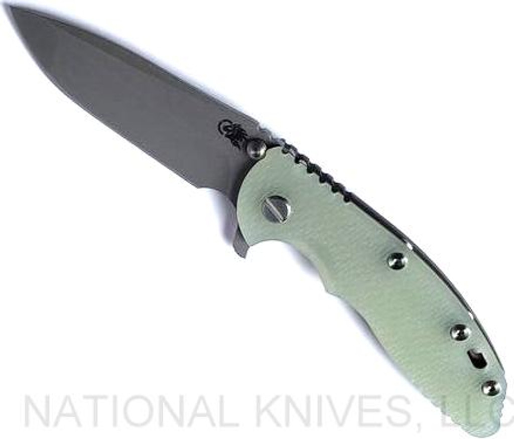 Rick Hinderer Knives XM-18 3.5" Spanto folding knife with thumb stud and flipper tab - shown open presentation side.  Working Finish S45VN stainless steel plain edge blade.  Translucent Green G-10 handle with Battle Bronze lock side.  Model KXM35SPA.