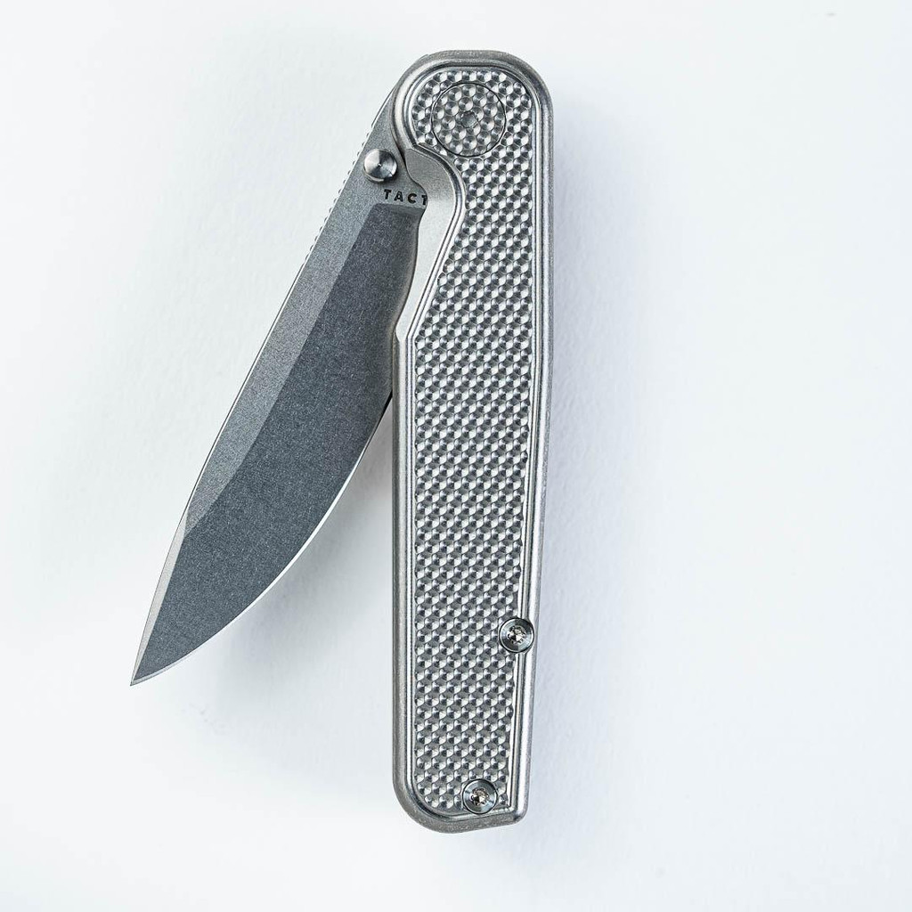 Tactile Knife Co Golf Rockwall folding knife with thumb stud - shown partially open presentation side.  Stonewash MagnaCut stainless steel plain edge blade.  Titanium handle.