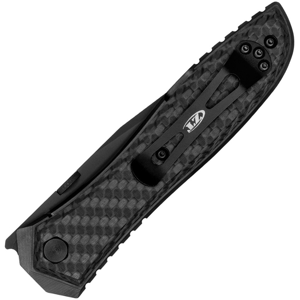 Zero Tolerance 0640BLK folding knife with thumb disk opener - closed - lock side.  Black 20CV stainless steel plain edge blade.  Black carbon fiber and titanium handle.  Model 0640BLK.
For reference only.
