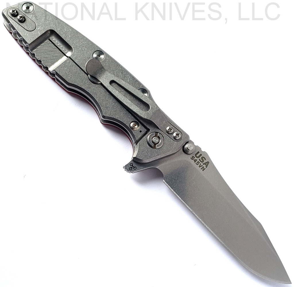 Rick Hinderer Knives Eklipse Spear Point folding knife with flipper tab and thumb stud - shown open lock side.  Stonewash S45VN stainless steel plain edge blade.  Red G-10 handle with stonewash lock side.  Model KEK35SPE.