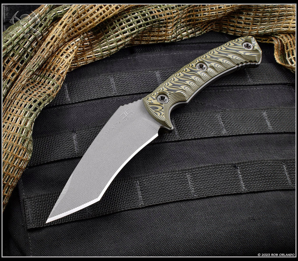 RMJ Tactical Peregrine fixed blade knife - shown out of sheath reverse.  Tungsten Cerakote Nitro-V stainless steel plain edge blade.  Dirty Olive G-10.
