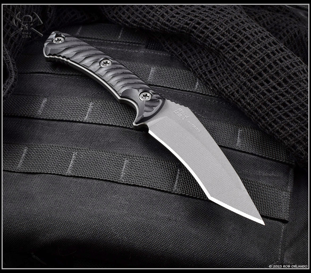 RMJ Tactical Peregrine fixed blade knife - shown out of sheath obverse.  Tungsten Cerakote Nitro-V stainless steel plain edge blade.  Black G-10.