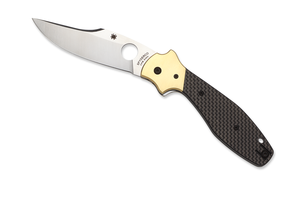 Spyderco Schempp Bowie folding knife with thumb hole - shown open presentation side.  Satin S30V stainless steel plain edge blade.  Black carbon fiber and G-10 laminate handle with brass bolster.  Model C190CFP.
For reference only.