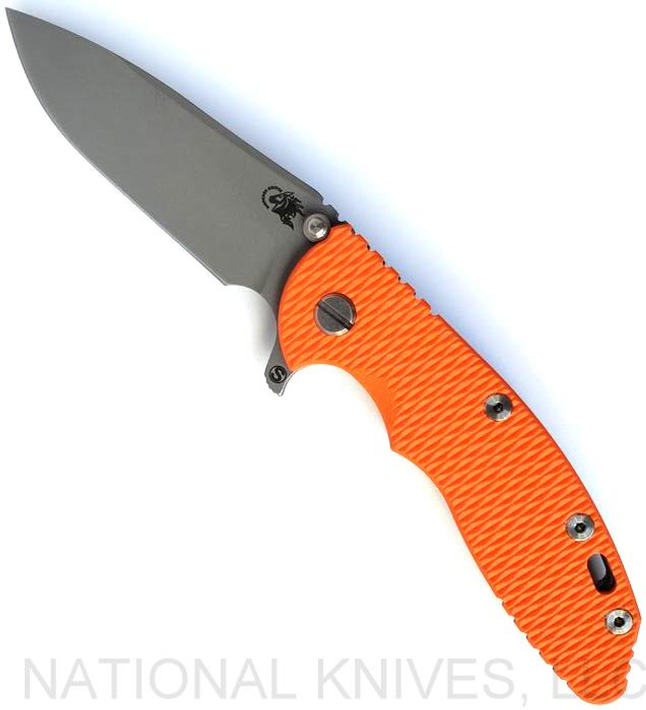 Rick Hinderer Knives Skinny XM-18 3.5" Slicer folding knife with thumb stud and flipper tab - shown open presentation side.  Working Finish MagnaCut stainless steel plain edge blade.  Orange G-10 handle with Working Finish lock side.  Model KXM35SKSL.